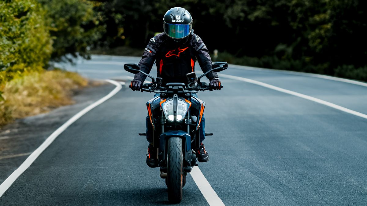 Motorcycle riding on a forest road, illustrating Georgia lane splitting law