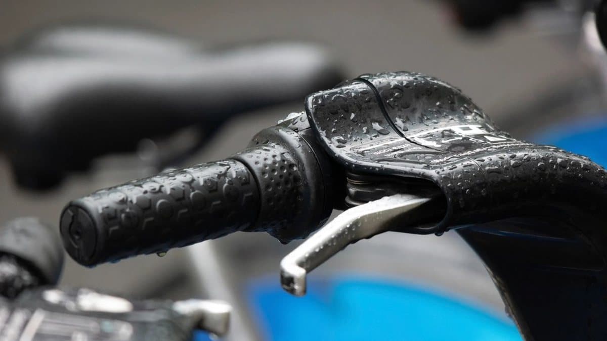 Close-up of a motorcycle handlebar grip and lever